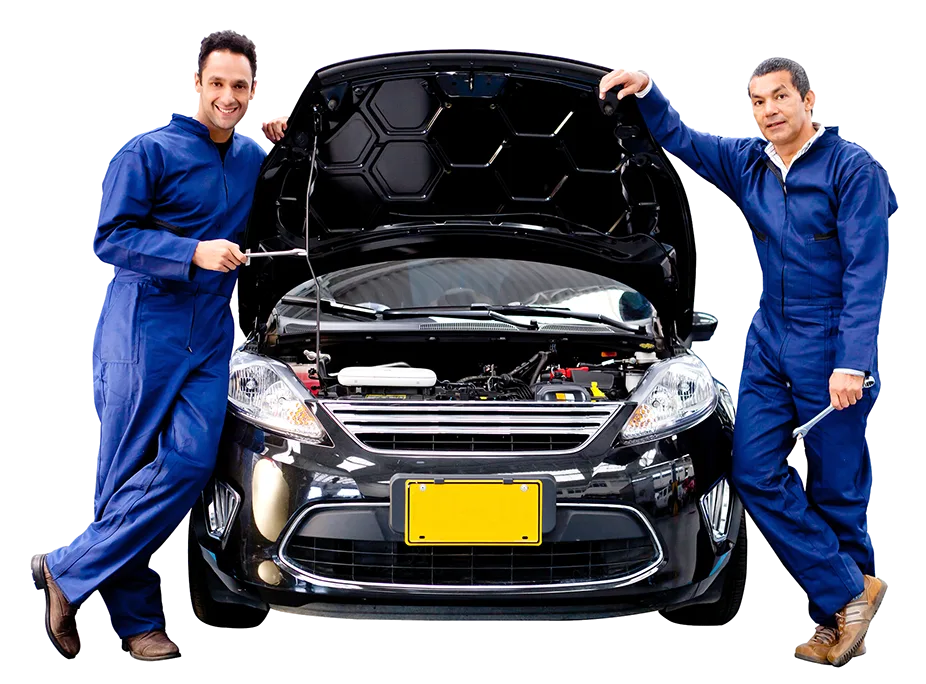 Técnicos realizando mantenimiento de aire acondicionado automotriz